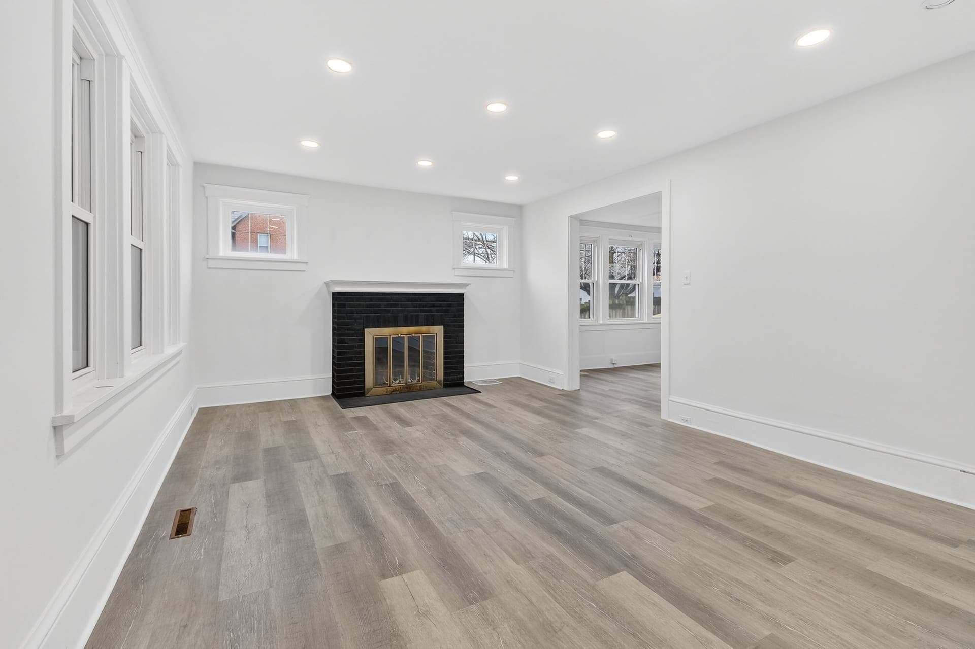 Living room with restored brick fireplace — New Holland Ave